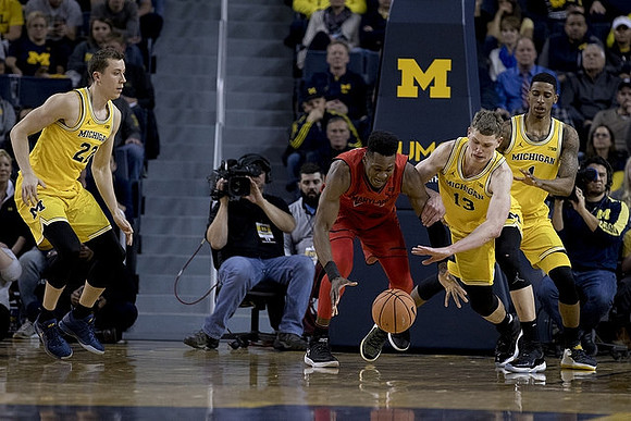 Duncan Robinson (22), Moritz Wagner (13), and Charles Matthews (1)