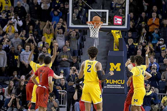 Muhammad-Ali Abdur-Rahkman (12), Jordan Poole (2), and Isaiah Livers (4)