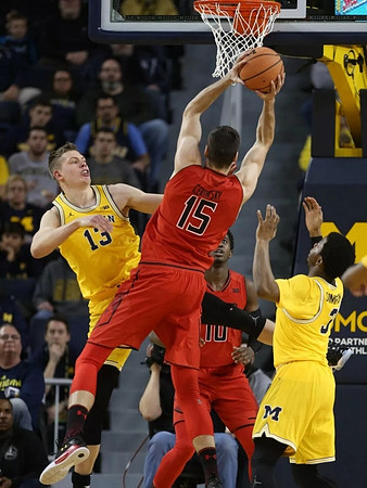 Moritz Wagner (13) and Zavier Simpson (3)