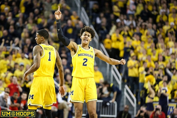 Charles Matthews (1) and Jordan Poole (2)