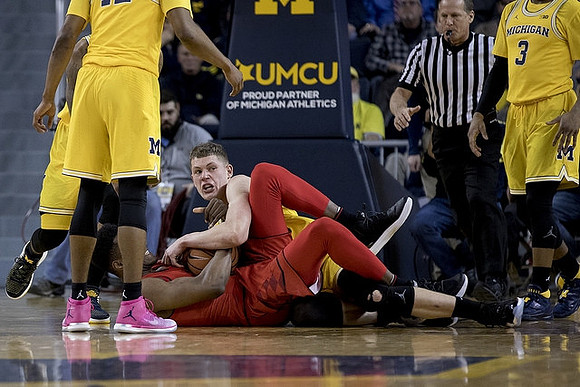Moritz Wagner (13) and Zavier Simpson (3)