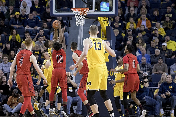 Duncan Robinson (22), Charles Matthews (1), Moritz Wagner (13), and Zavier Simpson (3)