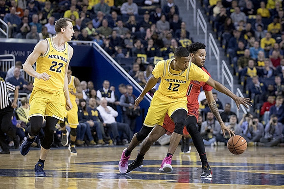 Duncan Robinson (22) and Muhammad-Ali Abdur-Rahkman (12)