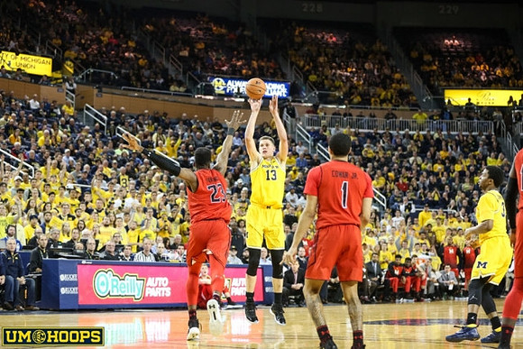 Moritz Wagner (13) and Zavier Simpson (3)