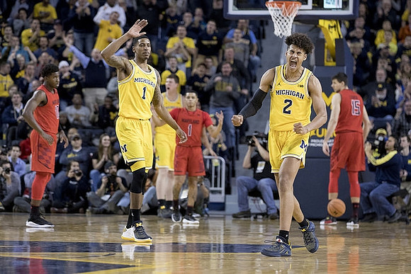 Charles Matthews (1), Jordan Poole (2), and Jon Teske (15)