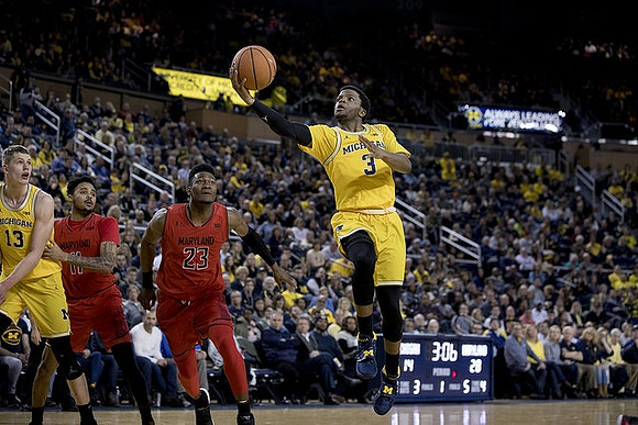 Moritz Wagner (13) and Zavier Simpson (3)