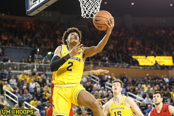Jordan Poole (2) and Jon Teske (15)