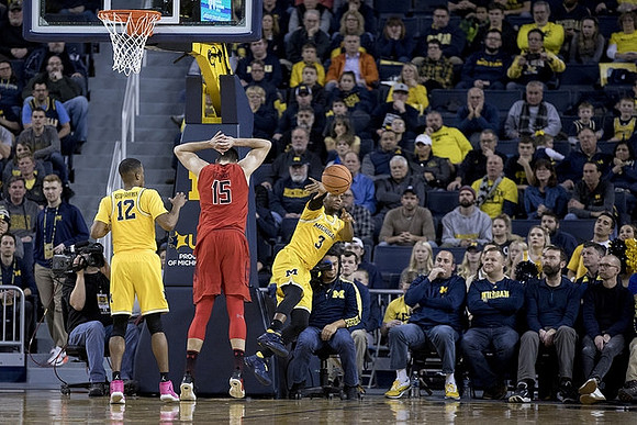 Muhammad-Ali Abdur-Rahkman (12) and Zavier Simpson (3)