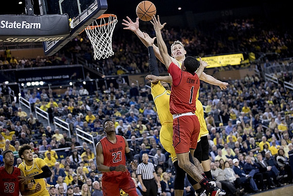 Moritz Wagner (13) and Isaiah Livers (4)