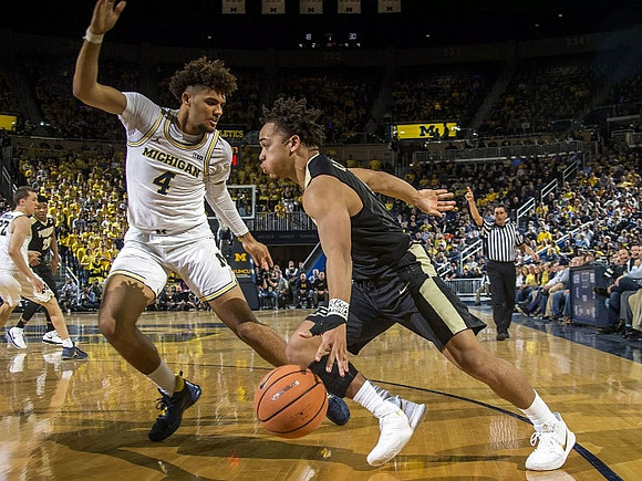 Isaiah Livers (4) and Duncan Robinson (22)