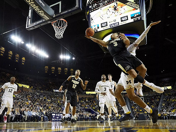 Zavier Simpson (3), Jon Teske (15), and Jordan Poole (2)