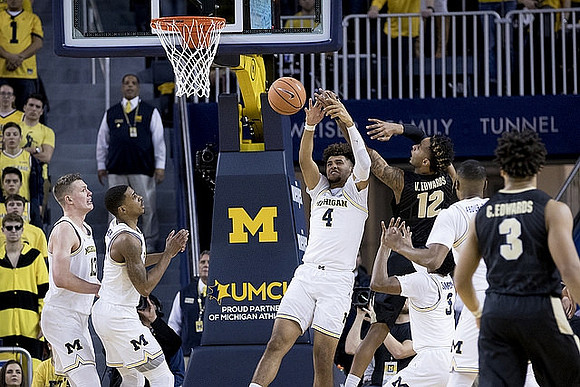 Muhammad-Ali Abdur-Rahkman (12), Charles Matthews (1), Isaiah Livers (4), Zavier Simpson (3), and Muhammad-Ali Abdur-Rahkman (12)