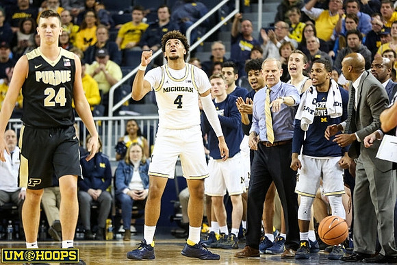 Isaiah Livers (4), John Beilein, and Michigan Team