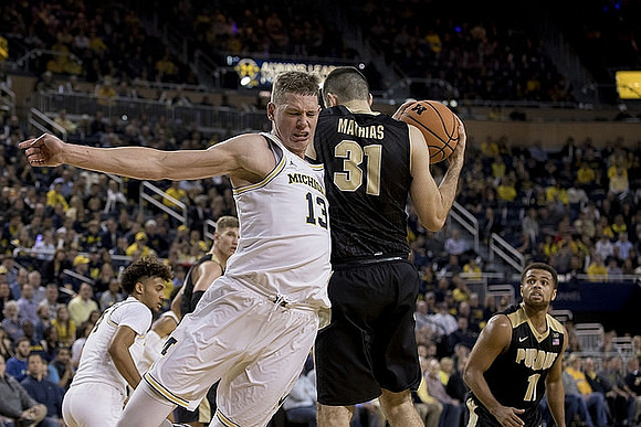 Isaiah Livers (4) and Moritz Wagner (13)