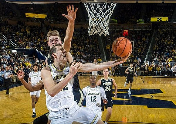 Isaiah Livers (4), Duncan Robinson (22), and Muhammad-Ali Abdur-Rahkman (12)