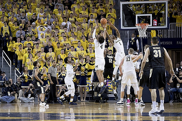 Zavier Simpson (3), Isaiah Livers (4), Charles Matthews (1), and Moritz Wagner (13)