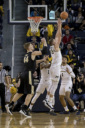 Charles Matthews (1), Moritz Wagner (13), and Isaiah Livers (4)