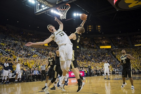 Moritz Wagner (13) and Zavier Simpson (3)
