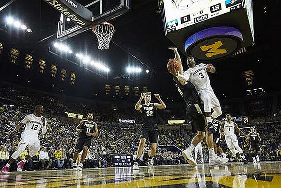 Muhammad-Ali Abdur-Rahkman (12), Zavier Simpson (3), and Charles Matthews (1)
