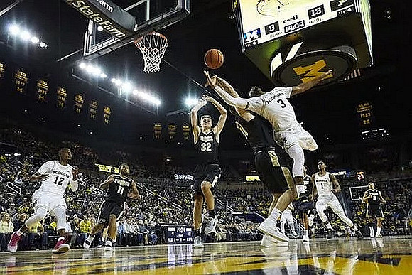 Muhammad-Ali Abdur-Rahkman (12), Zavier Simpson (3), and Charles Matthews (1)