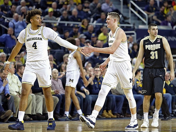Isaiah Livers (4) and Moritz Wagner (13)