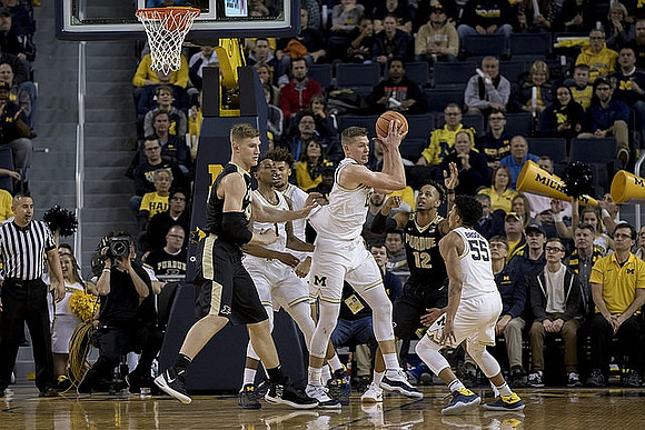 Charles Matthews (1), Isaiah Livers (4), Moritz Wagner (13), and Eli Brooks (55)