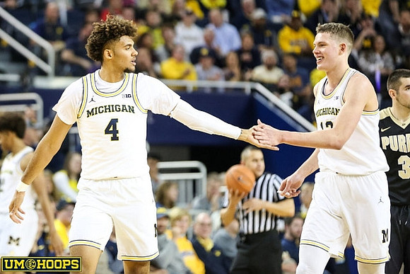 Isaiah Livers (4) and Moritz Wagner (13)