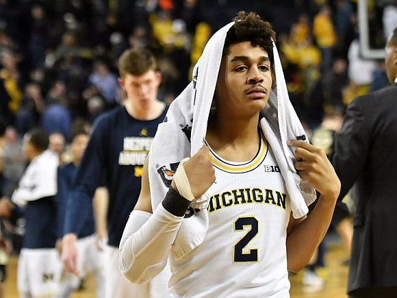 Jon Teske (15) and Jordan Poole (2)