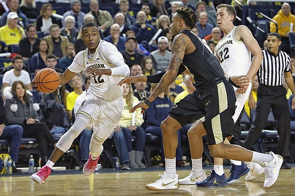 Muhammad-Ali Abdur-Rahkman (12) and Duncan Robinson (22)