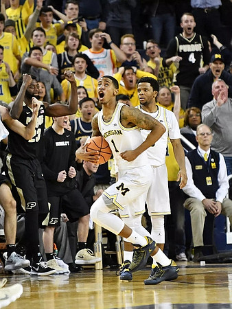 Charles Matthews (1) and Zavier Simpson (3)