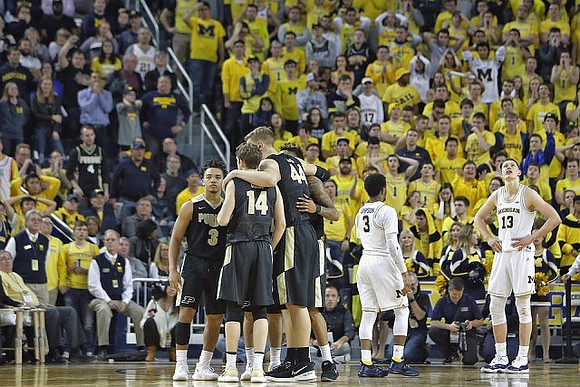 Zavier Simpson (3) and Moritz Wagner (13)