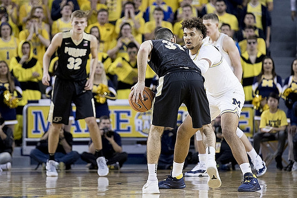 Isaiah Livers (4) and Moritz Wagner (13)