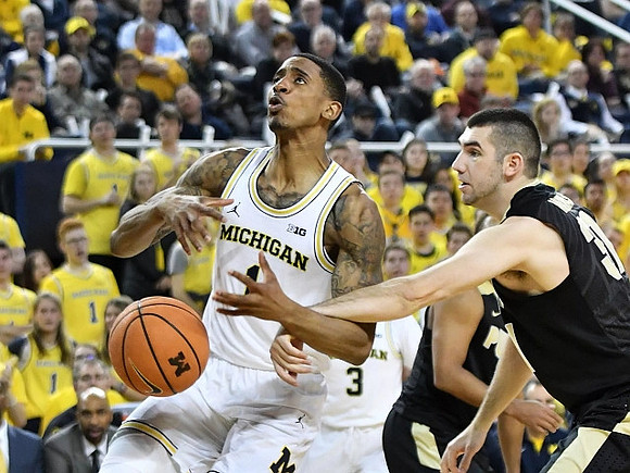 Charles Matthews (1) and Zavier Simpson (3)