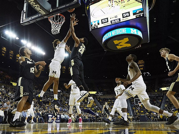 Muhammad-Ali Abdur-Rahkman (12), Isaiah Livers (4), Zavier Simpson (3), and Charles Matthews (1)