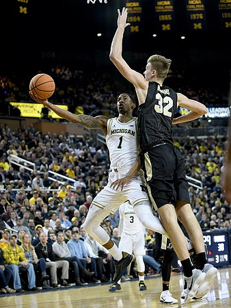 Charles Matthews (1) and Zavier Simpson (3)