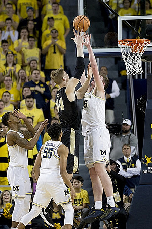 Charles Matthews (1), Eli Brooks (55), and Jon Teske (15)