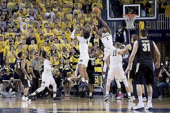 Zavier Simpson (3), Isaiah Livers (4), Charles Matthews (1), and Moritz Wagner (13)