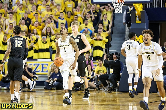Charles Matthews (1), Zavier Simpson (3), and Isaiah Livers (4)