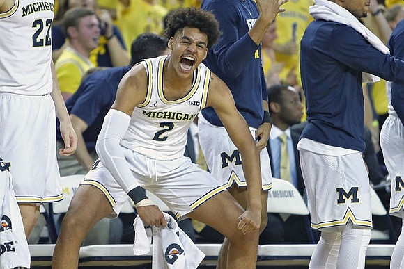 Duncan Robinson (22) and Jordan Poole (2)