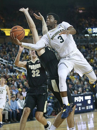 Zavier Simpson (3) and Duncan Robinson (22)