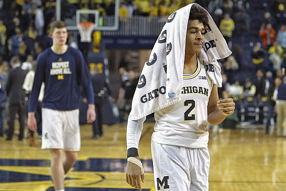 Jon Teske (15) and Jordan Poole (2)