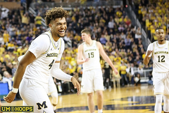 Isaiah Livers (4), Jon Teske (15), and Muhammad-Ali Abdur-Rahkman (12)