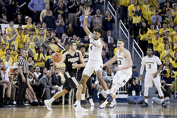 Isaiah Livers (4), Moritz Wagner (13), and Zavier Simpson (3)
