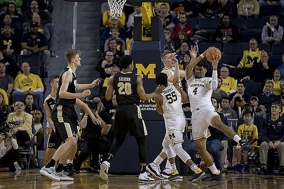 Eli Brooks (55), Moritz Wagner (13), and Isaiah Livers (4)