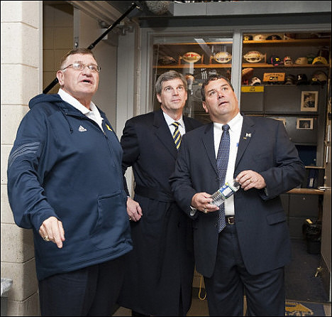 Jon Falk, David Brandon,  and Brady Hoke