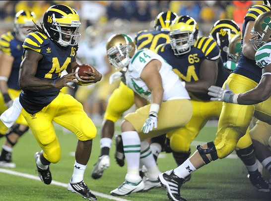 Denard Robinson (16), Patrick Omameh (65), and Michael Shaw (20)