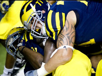 Vincent Smith (2) and Taylor Lewan (77)