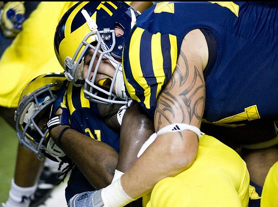 Vincent Smith (2) and Taylor Lewan (77)