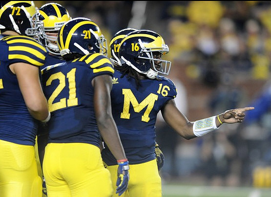 Mark Huyge (72), Junior Hemingway (21), and Denard Robinson (16)