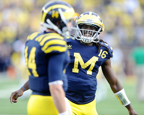 Jack Kennedy (14) and Denard Robinson (16)